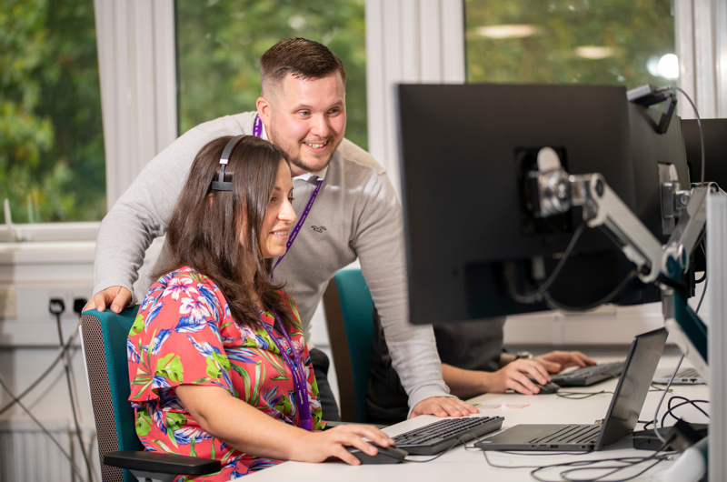 Line manager working with employee